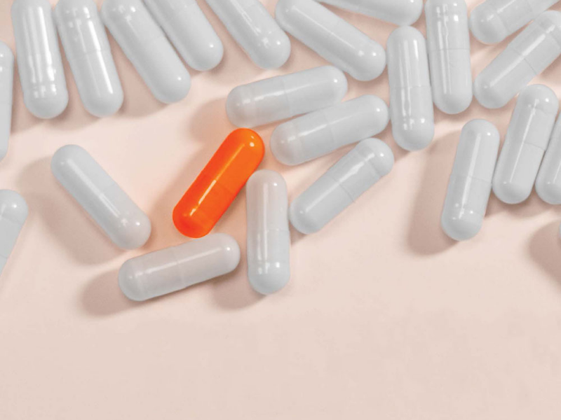 Pills scattered on surface