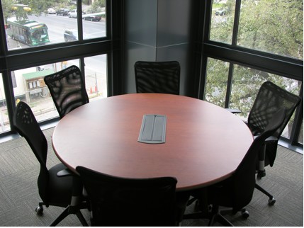An empty conference room table in BME 4.202G with 6 chairs
