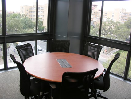 An empty conference room table in BME 5.202H with 6 chairs