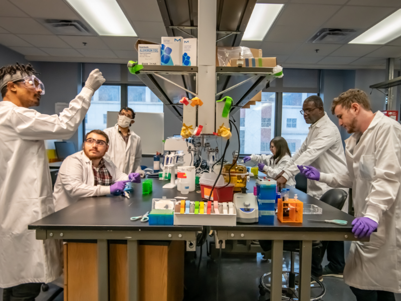 Texas BME faculty member Tyrone Porter and student researchers working in the lab
