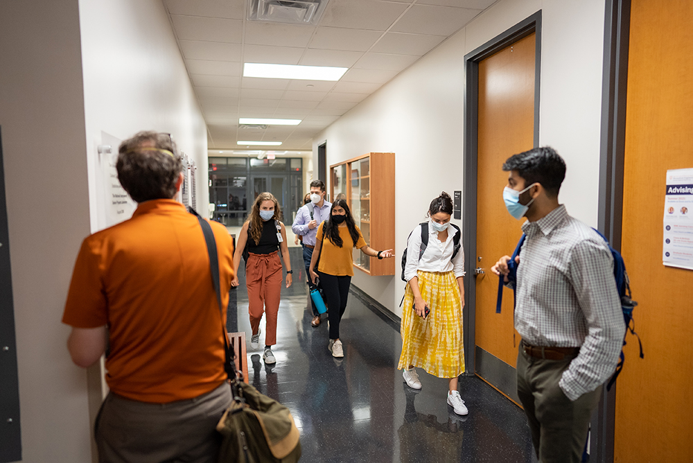 BME students in a hallway wearing masks