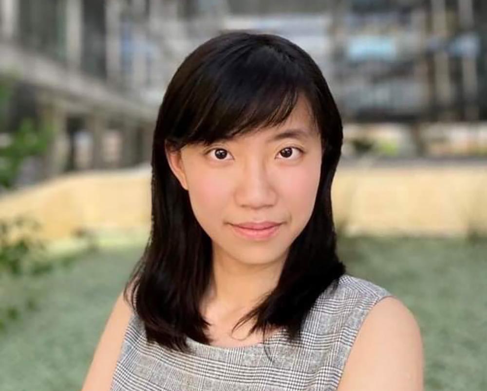 Nina Chen smiling wearing grey top