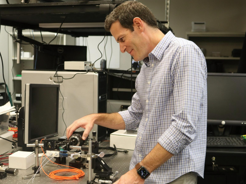 James Tunnell in lab with equipment