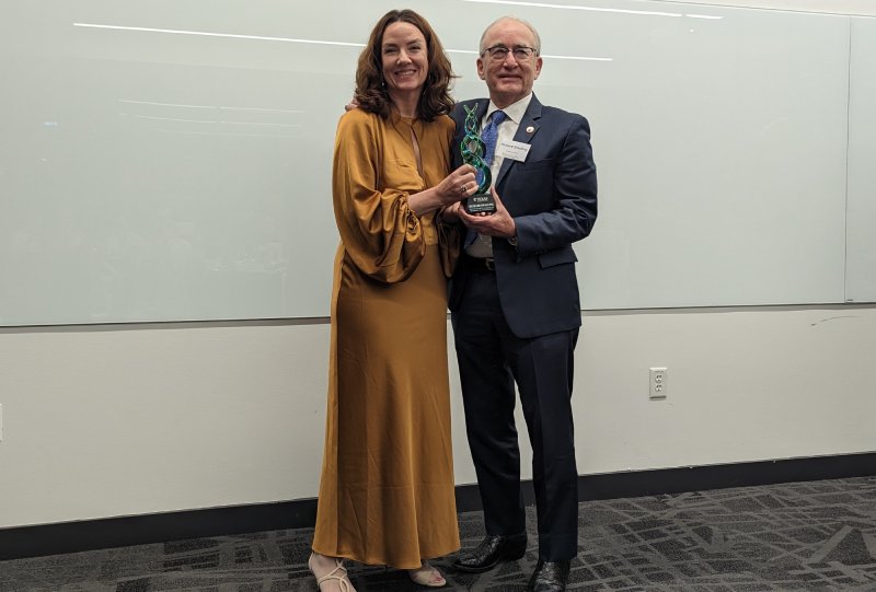 Texas Engineers Laura Suggs and Richard Smalling smiling and holding award