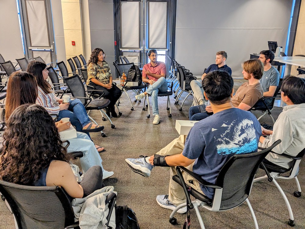 Texas Engineering students sitting in a circle