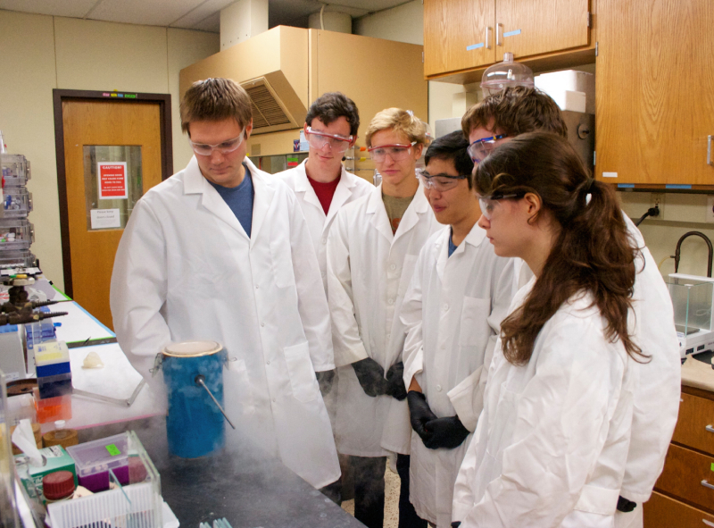 A group of biomedical engineering graduate students work in a lab.