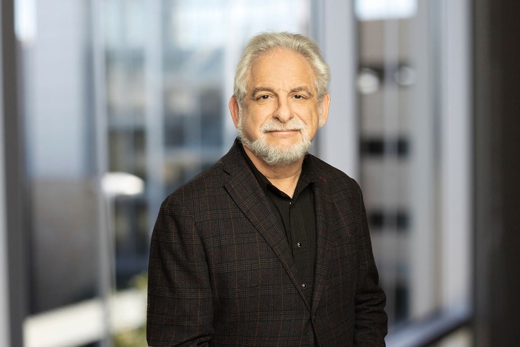 Michael Sacks smiling wearing black shirt