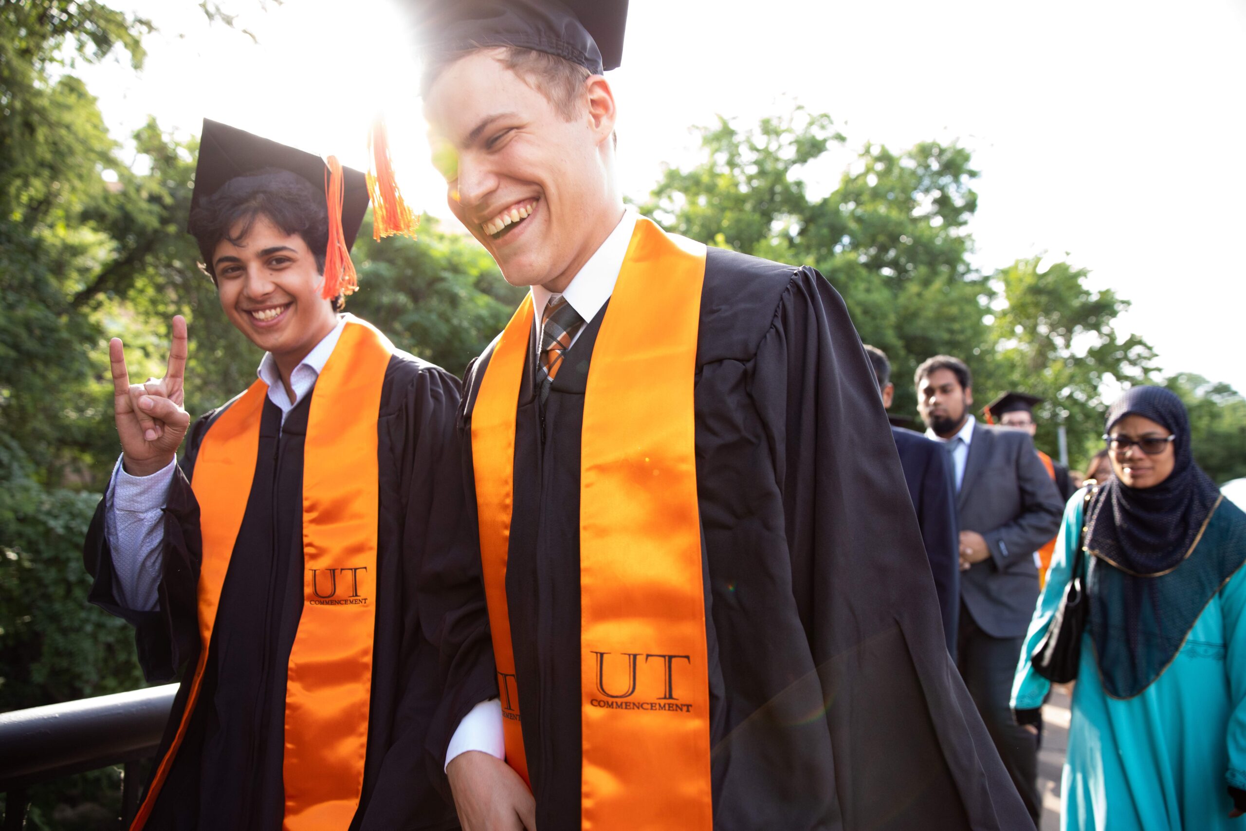 Texas BME students walking in cap and gown