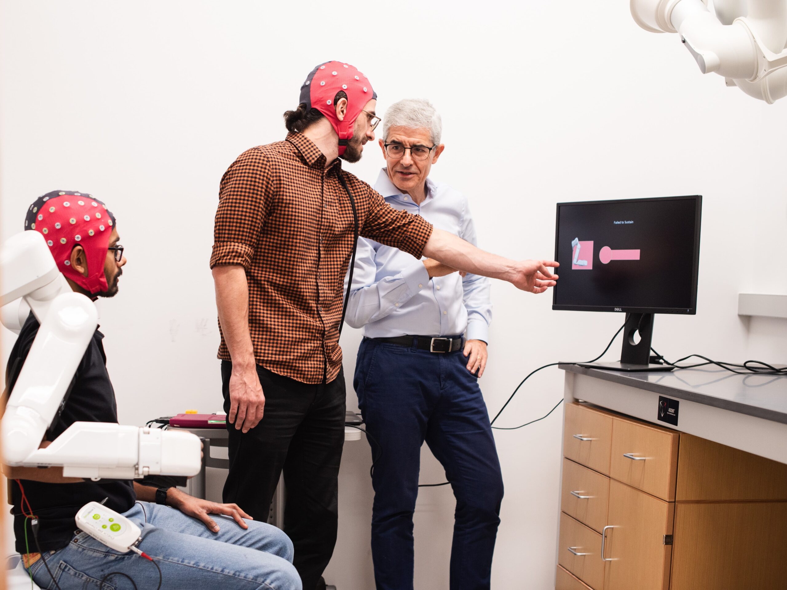 Texas Engineer José del R. Millán and researchers testing brain-computer interface prototype