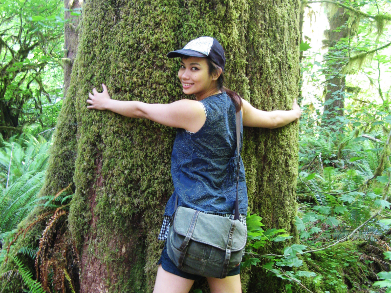 Nuttada Panpradist hugging a tree at Lutz River
