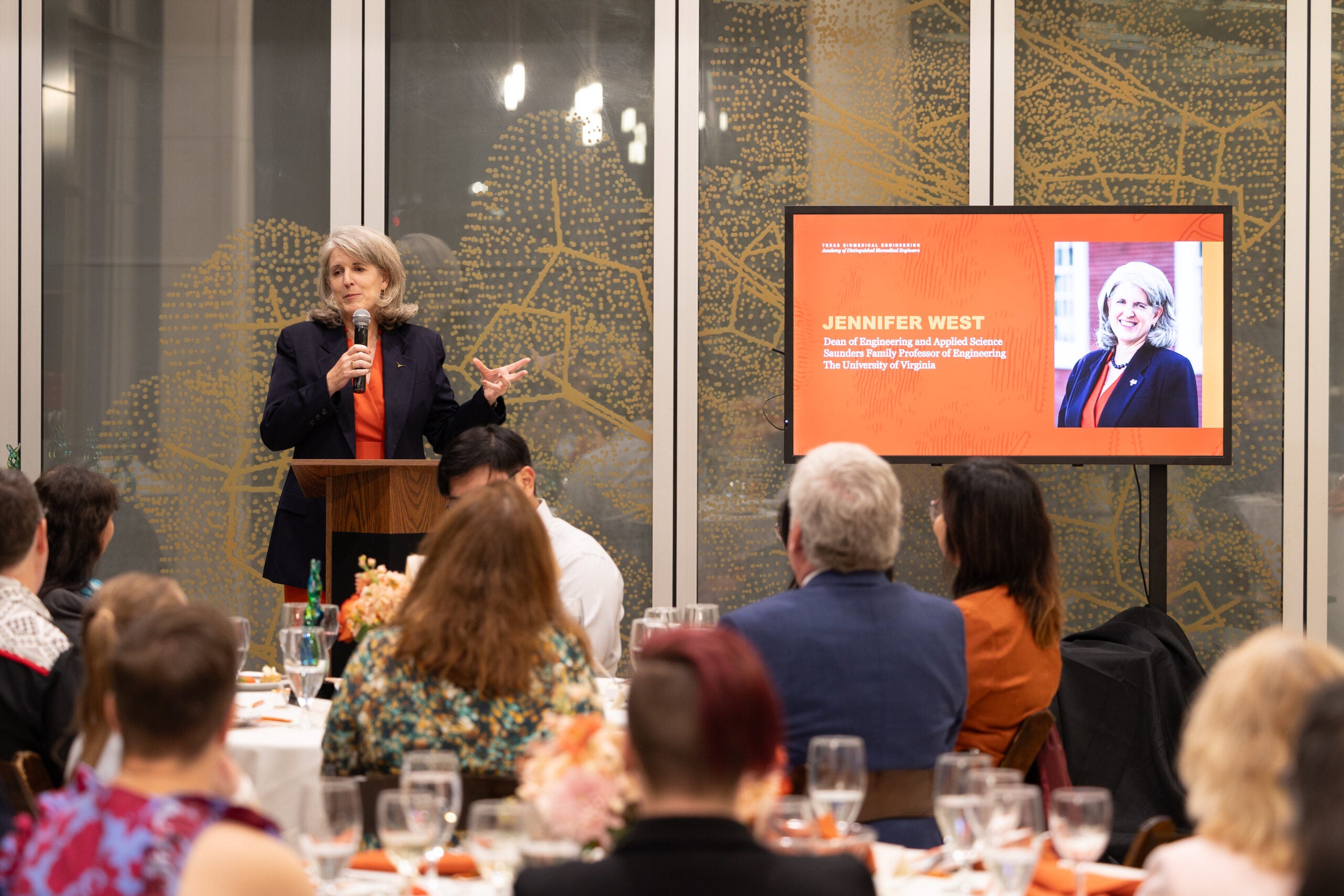 Texas BME alumna Jennifer West giving speech at podium during Adacemy of Distinguished Biomedical Engineers awards ceremony
