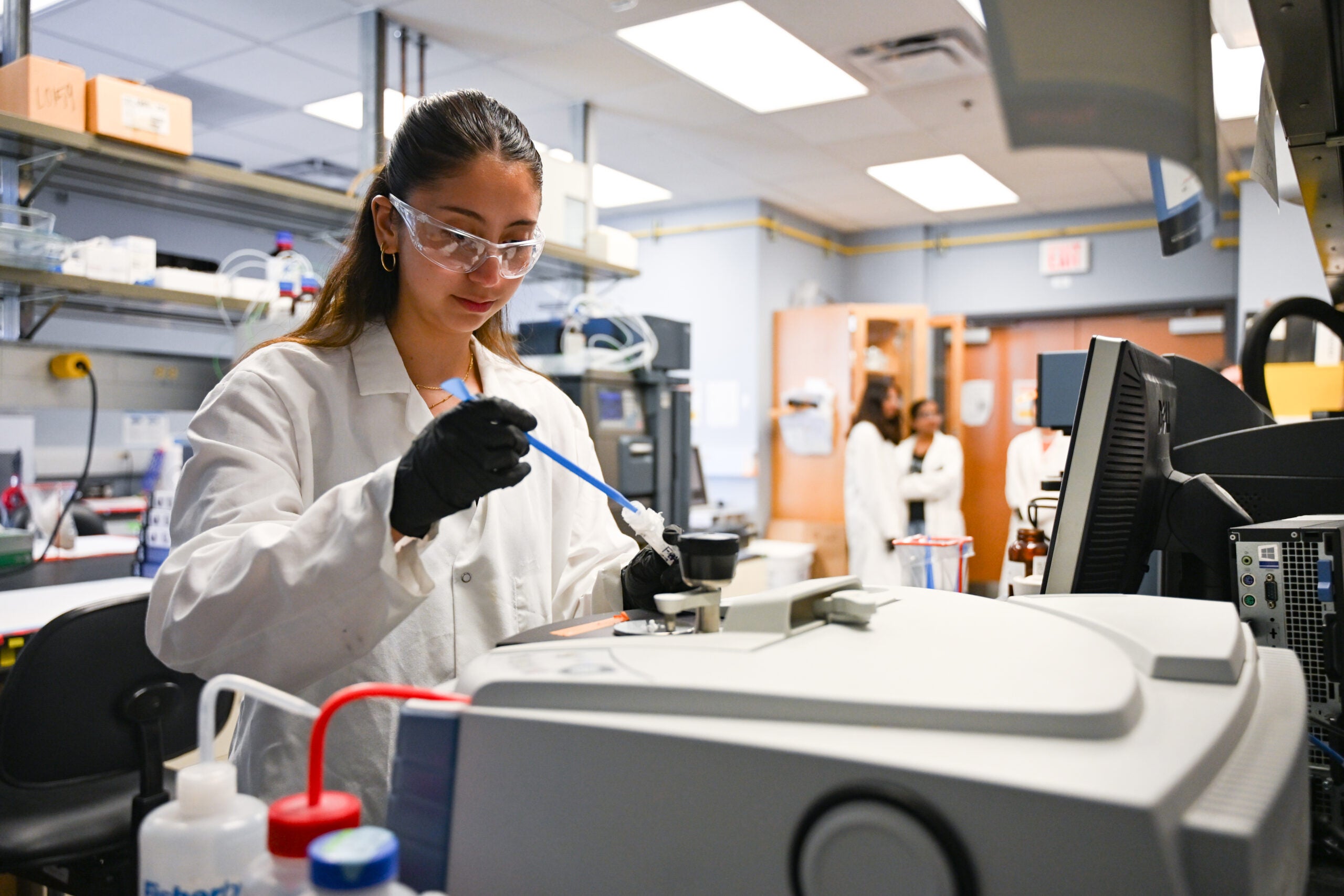 Student conducting research in Nicolas Peppas' lab
