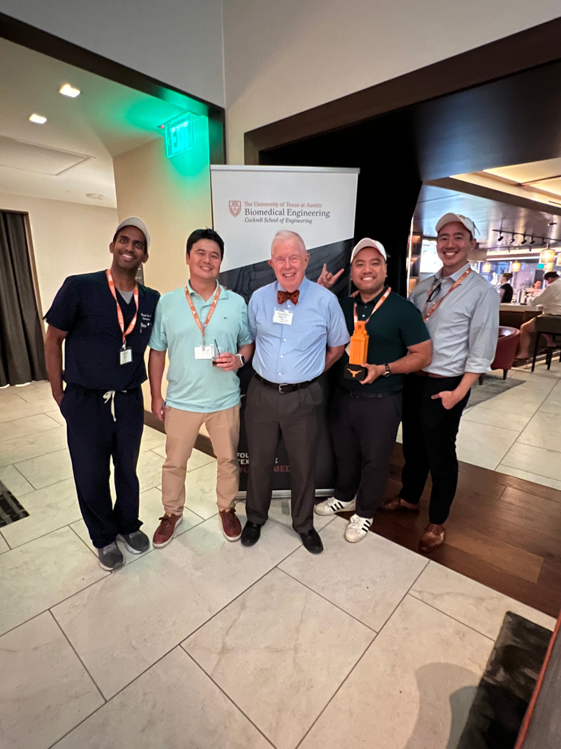 BME professor emeritus Ken Diller standing with BME class of 2006 graduates